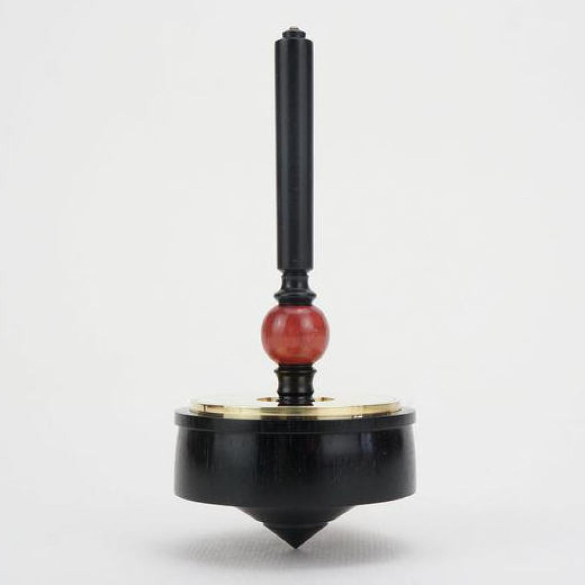 Collector's item: Artful Ebony Spinning Top with Brass Inlay